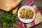 Mexican pork chicharron with green sauce tacos on wooden background