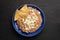 Mexican refried beans with cheese and totopos