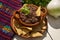 Mexican refried beans with totopos on white background