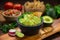 Mexican restaurant style side of Guacamole food and chips on a wood cutting board vertical shot with salsa
