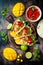 Mexican shrimp tacos with avocado, tomato, mango salsa on rustic stone table. Recipe for Cinco de Mayo party.