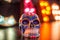 A mexican skull lit by multi colour lights