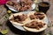 Mexican slow cooked lamb tacos also called barbacoa on wooden background