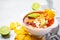 Mexican soup Chili con carne with beans, chicken, corn and nachos in white bowls - traditional mexican food