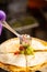 Mexican street fast food with quesadillas. Chef preparing food in food truck, adding salsa on tortilla