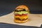 Mexican-style beef burger with melted cheddar cheese, ripe tomato slices and red onion, guacamole pasta