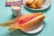 Mexican sweet tamales with strawberry jam on turquoise background