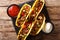Mexican tacos stuffed with minced beef and vegetables close-up. horizontal top view