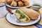 Mexican tamales of corn leaves with green sauce and atole, Tamales Breakfast in Mexico