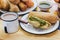 Mexican tamales of corn leaves with green sauce and atole, Tamales Breakfast in Mexico