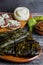 Mexican Tamales Oaxaquenos in banana leaves traditional from Oaxaca Mexico on wooden background