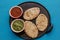 Mexican tlacoyos with green and red sauce, Traditional food in Mexico