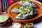 Mexican tlacoyos with green sauce