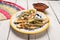 Mexican tlacoyos with nopal cactus and cheese on white background