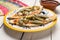 Mexican tlacoyos with nopal cactus and cheese on white background