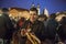 Mexican tourist enjoying hot chicken meat skewer from Christmas kiosk during Christmas event of lighting a Christmas tree at the O