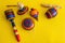 Mexican toys from Wooden, balero, yoyo and trompo in Mexico on a yellow background