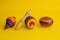 Mexican toys from Wooden, balero, yoyo and trompo in Mexico on a yellow background