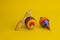 Mexican toys from Wooden, balero, yoyo and trompo in Mexico on a yellow background