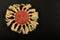 Mexican traditional ceramic happy sun plate isolated on black