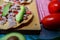 Mexican tuna tostadas and vegetables above a checkered tablecloth