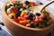 Mexican vegetable salad macro in a wooden plate. horizontal