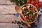 Mexican vegetable salad in a wooden bowl, close-up horizontal to