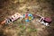 Mexican wedding. Sombrero hat, wedding bouquet, two guitars on the grass. Close up, outdoor. Bright blue, orange, brown, green, pu