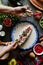 Mexican woman hands preparing and cooking chiles en nogada recipe with Poblano chili and ingredients, traditional dish in Puebla M