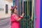 Mexican woman wearing embroidered dress and Lele doll headband.