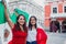 Mexican women with flags enjoying Mexican Independence Day party