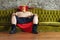 Mexican wrestler sitting on a couch