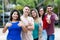 Mexican young adult woman with group of friends in line