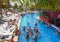 Mexico, Cancun. Group of young people relaxing and sunbathing in the pool. Cancun Grand Pyramid entertaining c