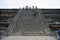 Mexico City, Mexico - November 22, 2015: View up the steps of a ruin at Teotihuacan in Mexico City, with people climbing up to the