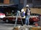 Mexico City, Mexico - November 27, 2015: Mexican Surveyors working on a road in Mexico City with taxi in background