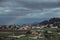 Mexico country landscape, a rainbow appearing on the horizon in front of a hill