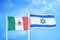 Mexico and Israel two flags on flagpoles and blue cloudy sky