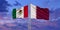 Mexico and Qatar flag waving in the wind against white cloudy blue sky together. Diplomacy concept, international relations