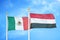 Mexico and Yemen two flags on flagpoles and blue cloudy sky