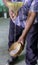 Mezcal is poured through a funnel to study the bubbles and determine the alcohol level in the drink