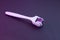 Mezoroller, dermaroller, mesotherapy skin tool. A mesoroller with a white handle and a pink rabbit on a dark background. Roller se