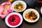 Mezze trio of beet hummus, baked cauliflower and polenta with bacon