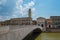 Mezzo Bridge over the River Arno, Tower of the Pretorio Palace and the Municipality of Pisa in Tuscany, Italy