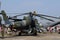 Mi-24V Hind helicopter - Mechanic sitting on a pr