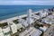 Miami Beach, Florida, USA - Aug 5, 2023: Aerial view of luxury apartments and hotels and the boardwalk stretching from Mid - Beach