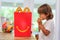 Miami, FL - July 28, 2020: Boy child eating Mcdonalds happy meal burger at home after getting drive-thru lunch during pamdemic