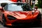 Miami, Florida, USA - JUNE 2020: Autumn fashion. Orange car. Exclusively to exotic sports cars and hypercars. McLaren is