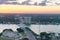 Miami outskirts aerial view on a cloudy sunset. Buildings, water and major interstate road