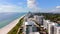 Miami stock footage circa 2023 October. View of ocean condominiums and walking path along dunes